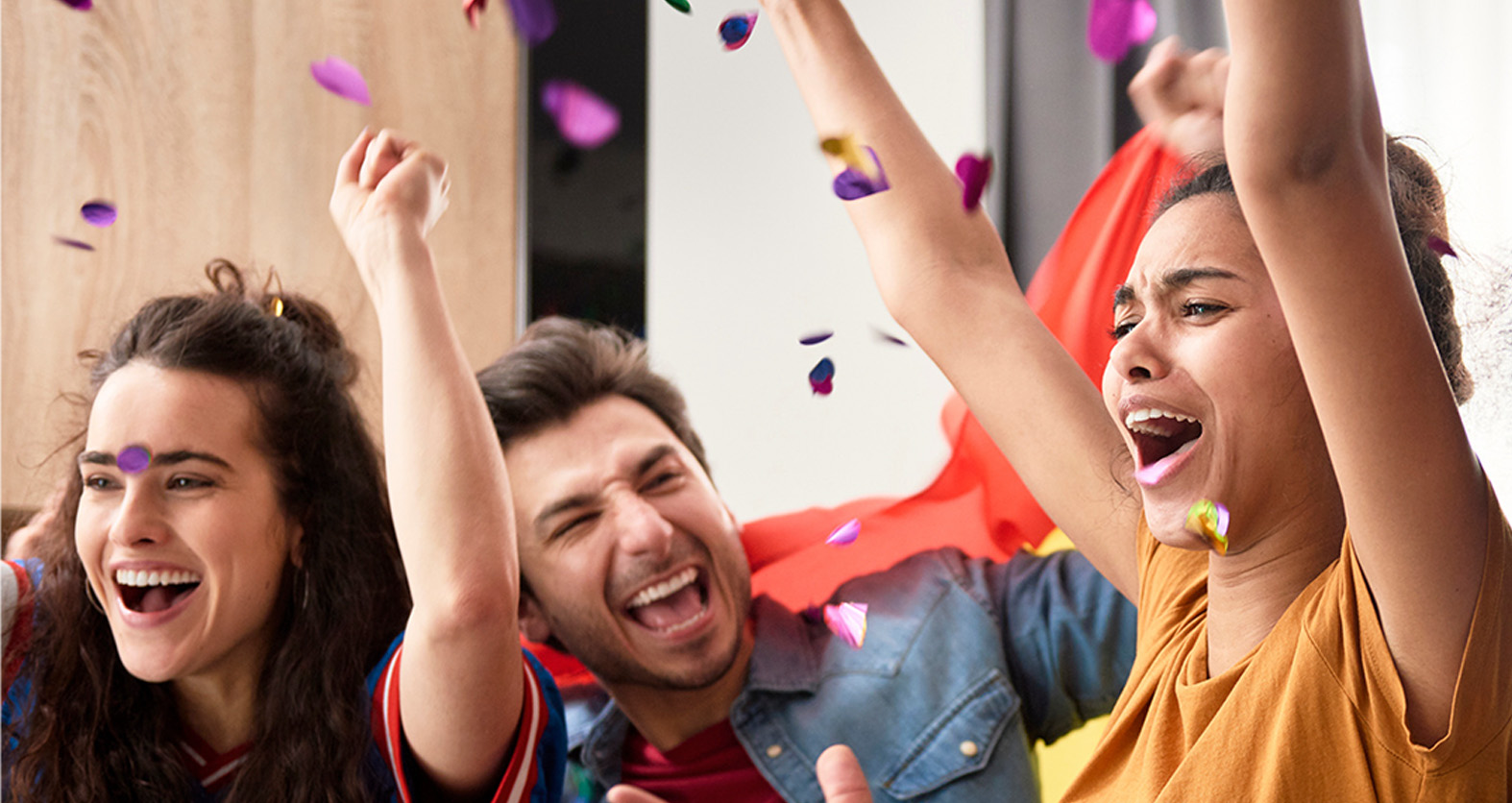 a group of people watching a sports game and rooting for their team